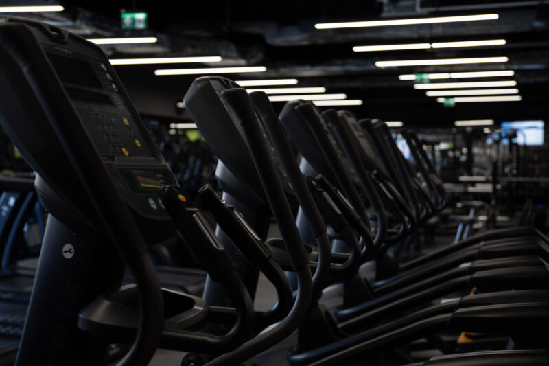 Details of the Matrix cardio machine control panels, showing the modern interface and ergonomic equipment handles.